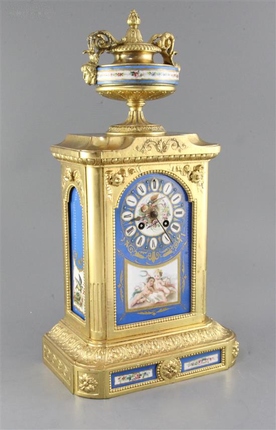A late 19th century Louis XVI style gilt brass eight day striking mantel clock, with Sevres style inset panels, 19.75in.